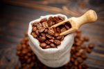 roasted coffee beans on dark wooden background